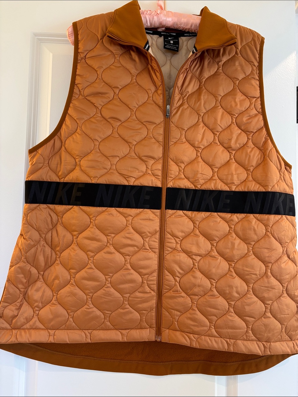 Nike Quilted Orange Sleeveless Vest with Black Logo Band